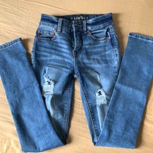 Girls distressed jeans by indigo rein, size w22 L25